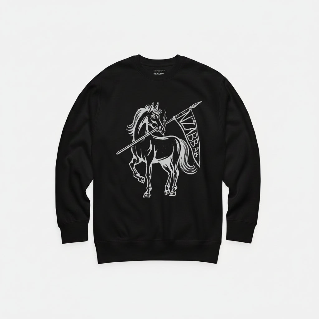 A black crewneck sweatshirt featuring a white graphic of a Viking warrior on horseback holding a spear and shield with the word 'VABBA' on it. The brand name 'VANGUARD' is printed inside the collar.